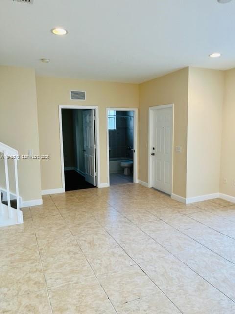 15655 Southwest 41st Street, Unit 201 Miramar, FL 33027 - Photo 8 of 18 a view of an empty room with closet and a bathroom