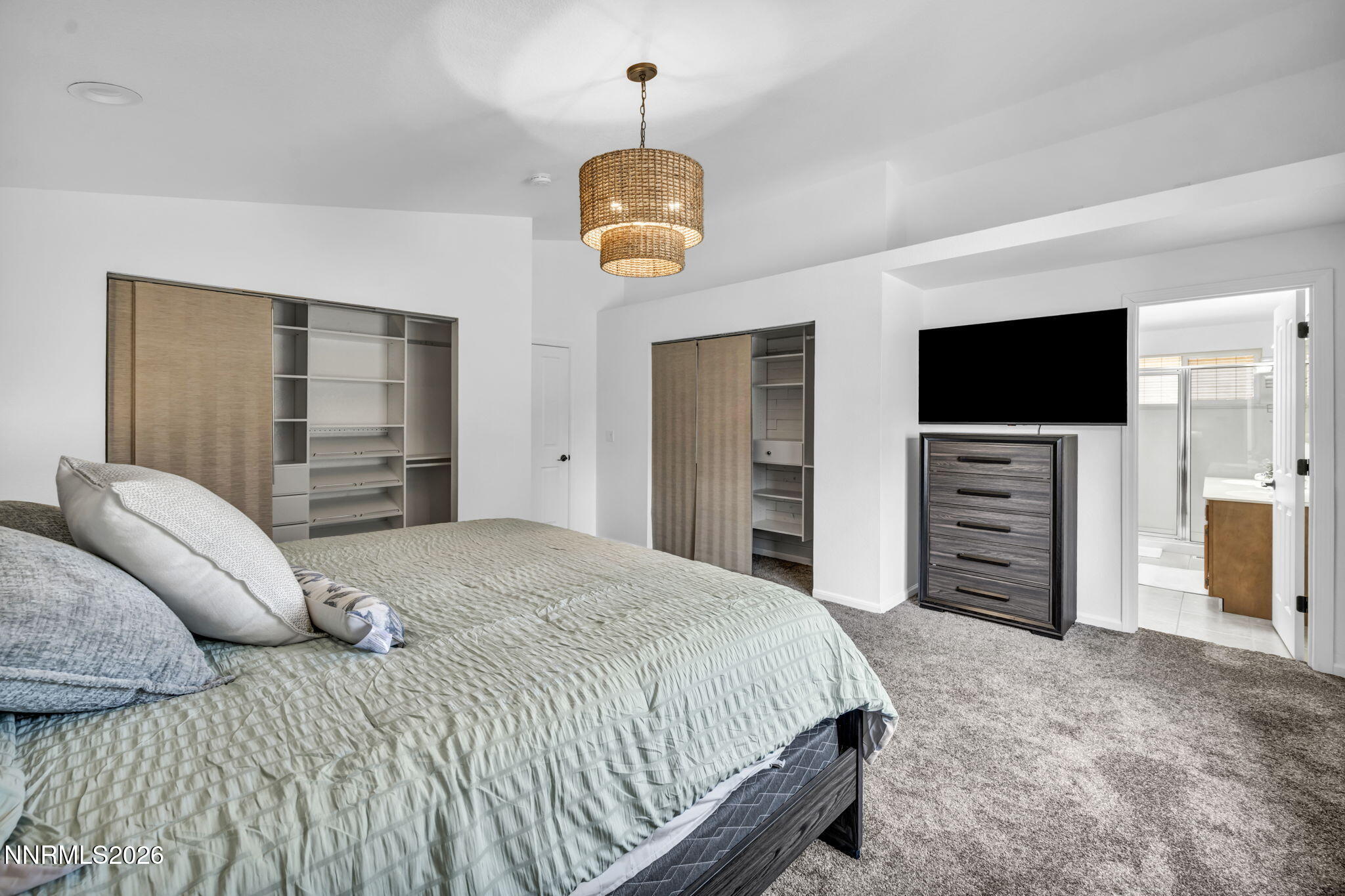 11680 Campo Rico Lane Sparks, NV 89441 - Photo 27 of 61 a bedroom with a bed and a flat screen tv