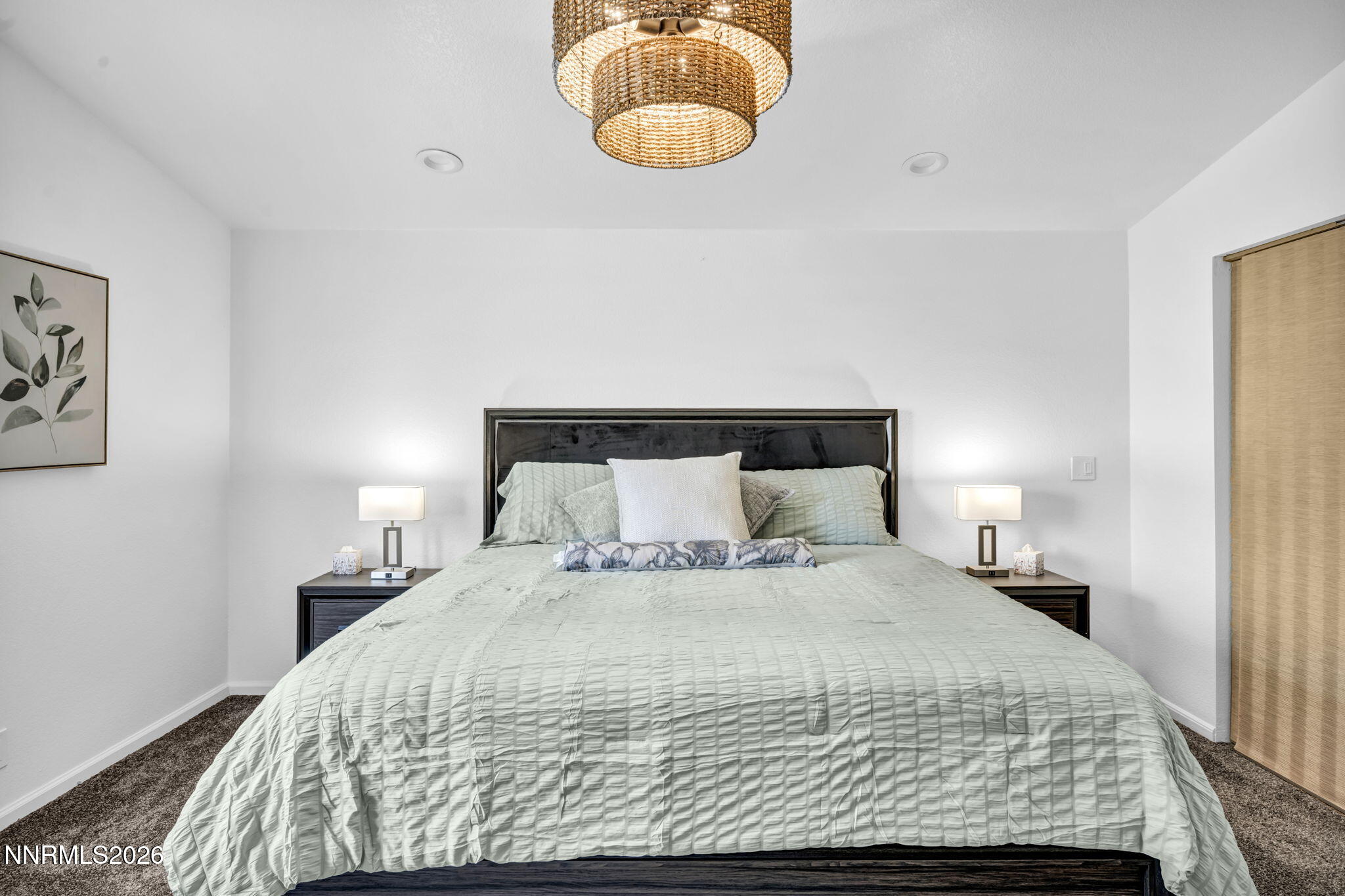 11680 Campo Rico Lane Sparks, NV 89441 - Photo 28 of 61 a bedroom with a bed and a painting on the wall