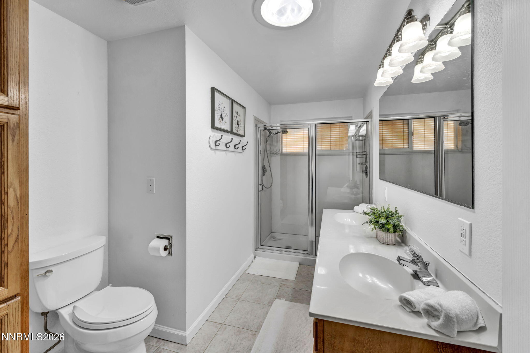 11680 Campo Rico Lane Sparks, NV 89441 - Photo 32 of 61 a bathroom with a sink a toilet and shower