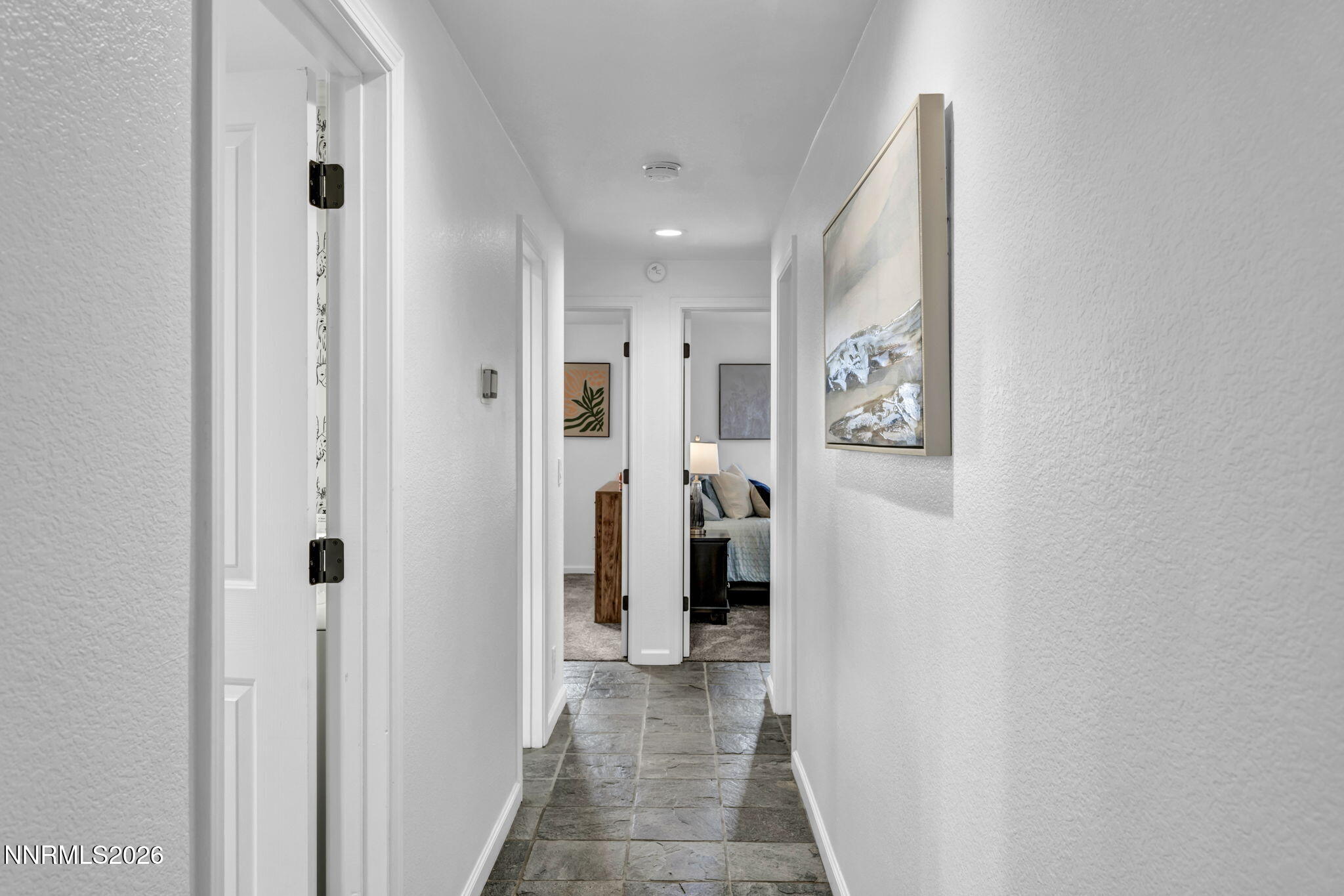 11680 Campo Rico Lane Sparks, NV 89441 - Photo 35 of 61 a view of a hallway with wooden shelves