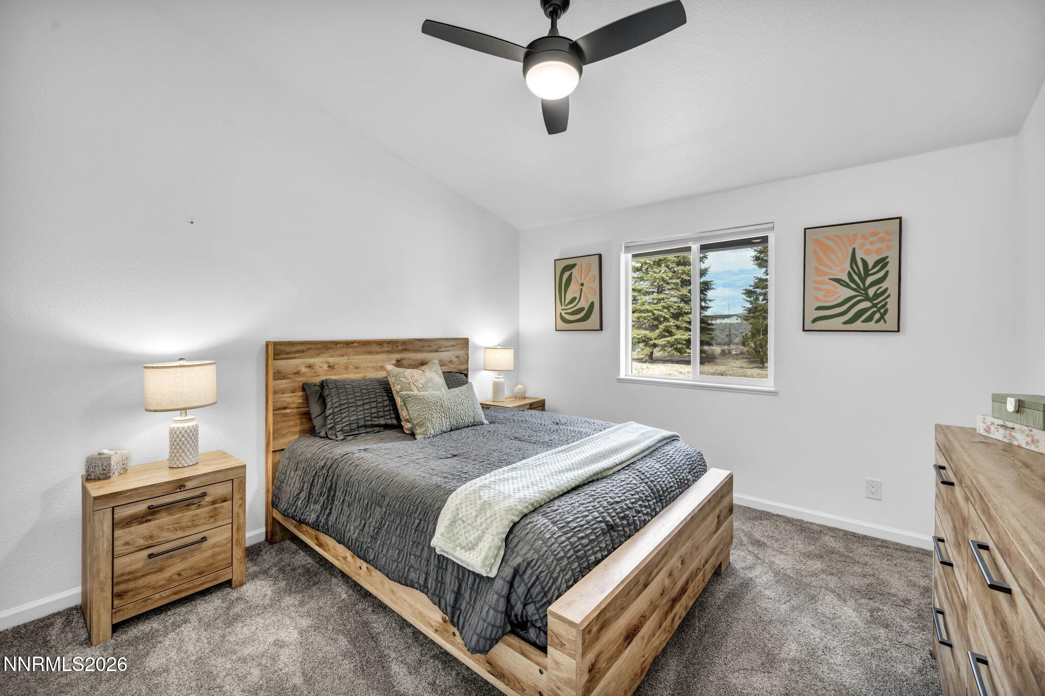 11680 Campo Rico Lane Sparks, NV 89441 - Photo 36 of 61 a bedroom with a bed and ceiling fan