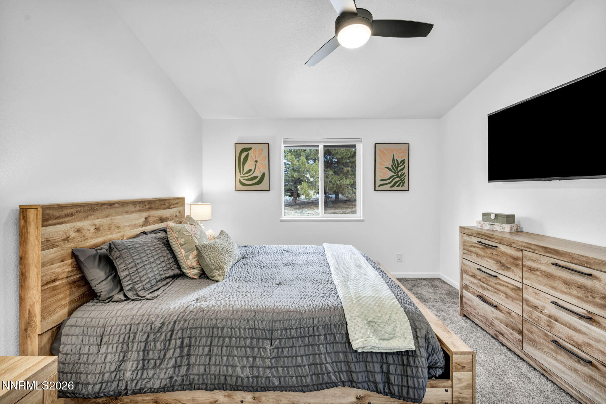 11680 Campo Rico Lane Sparks, NV 89441 - Photo 38 of 61 a bedroom with a bed and a flat screen tv