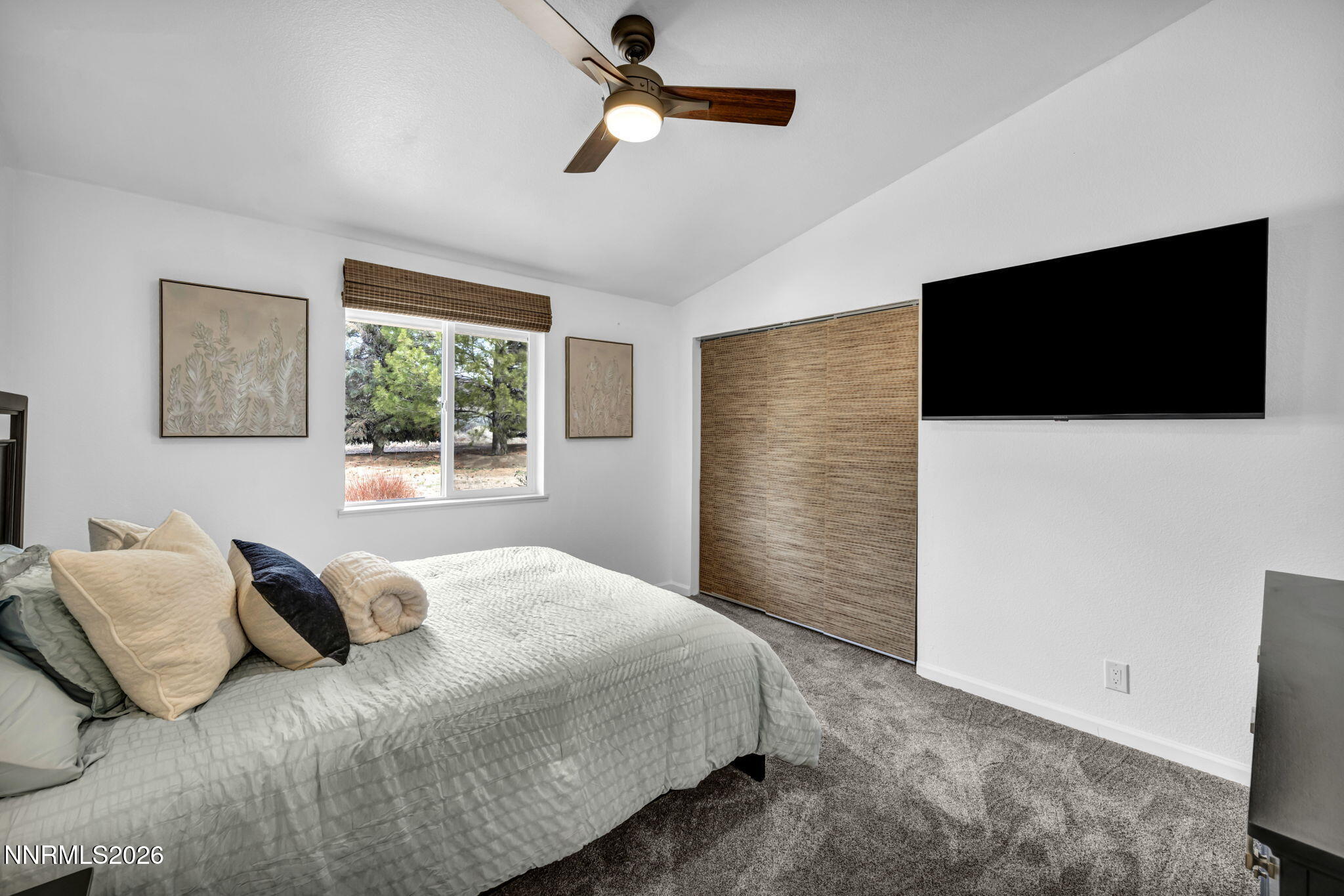 11680 Campo Rico Lane Sparks, NV 89441 - Photo 40 of 61 a bedroom with a large bed and a flat screen tv