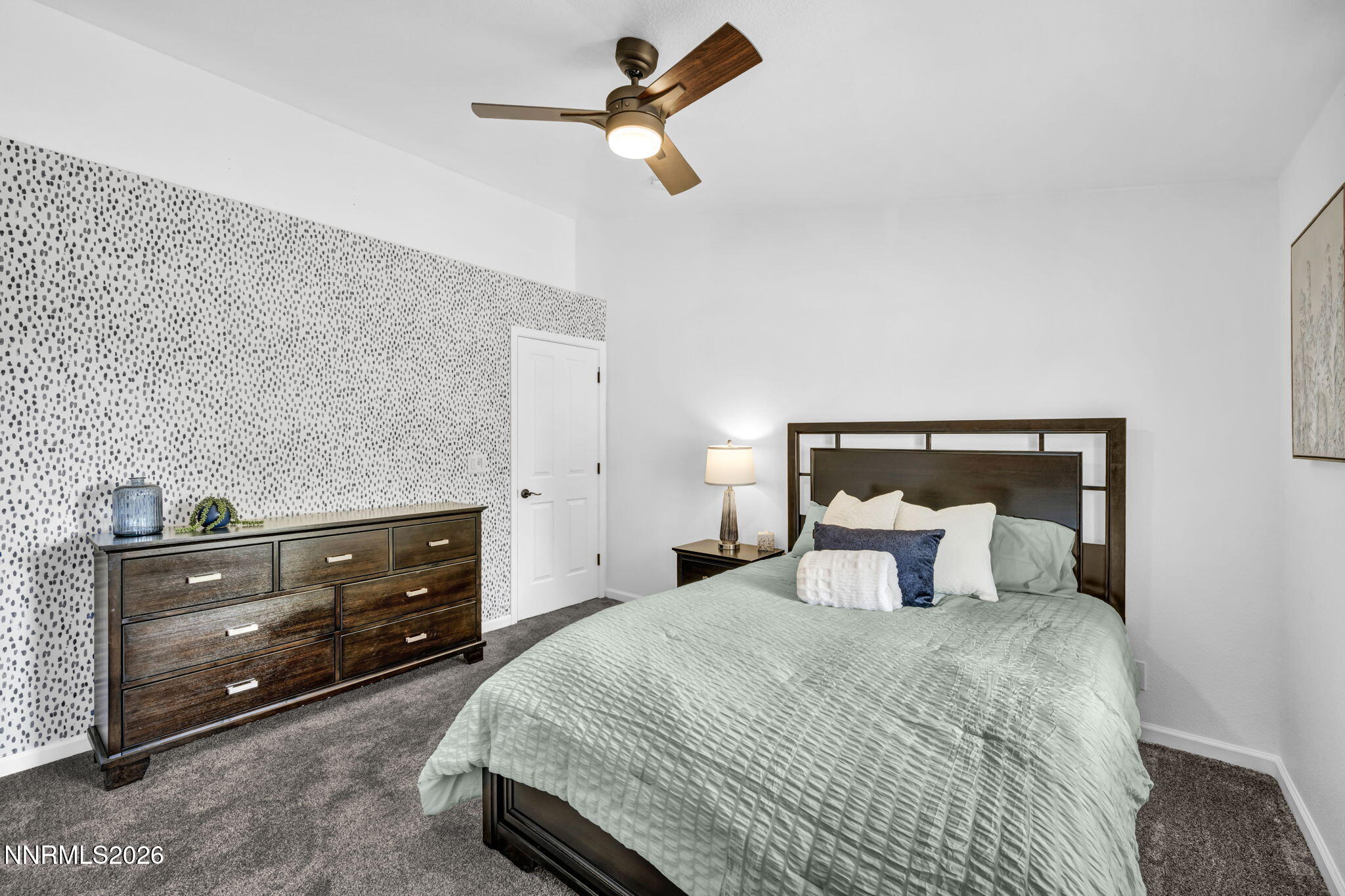 11680 Campo Rico Lane Sparks, NV 89441 - Photo 41 of 61 a bedroom with a bed and a dresser