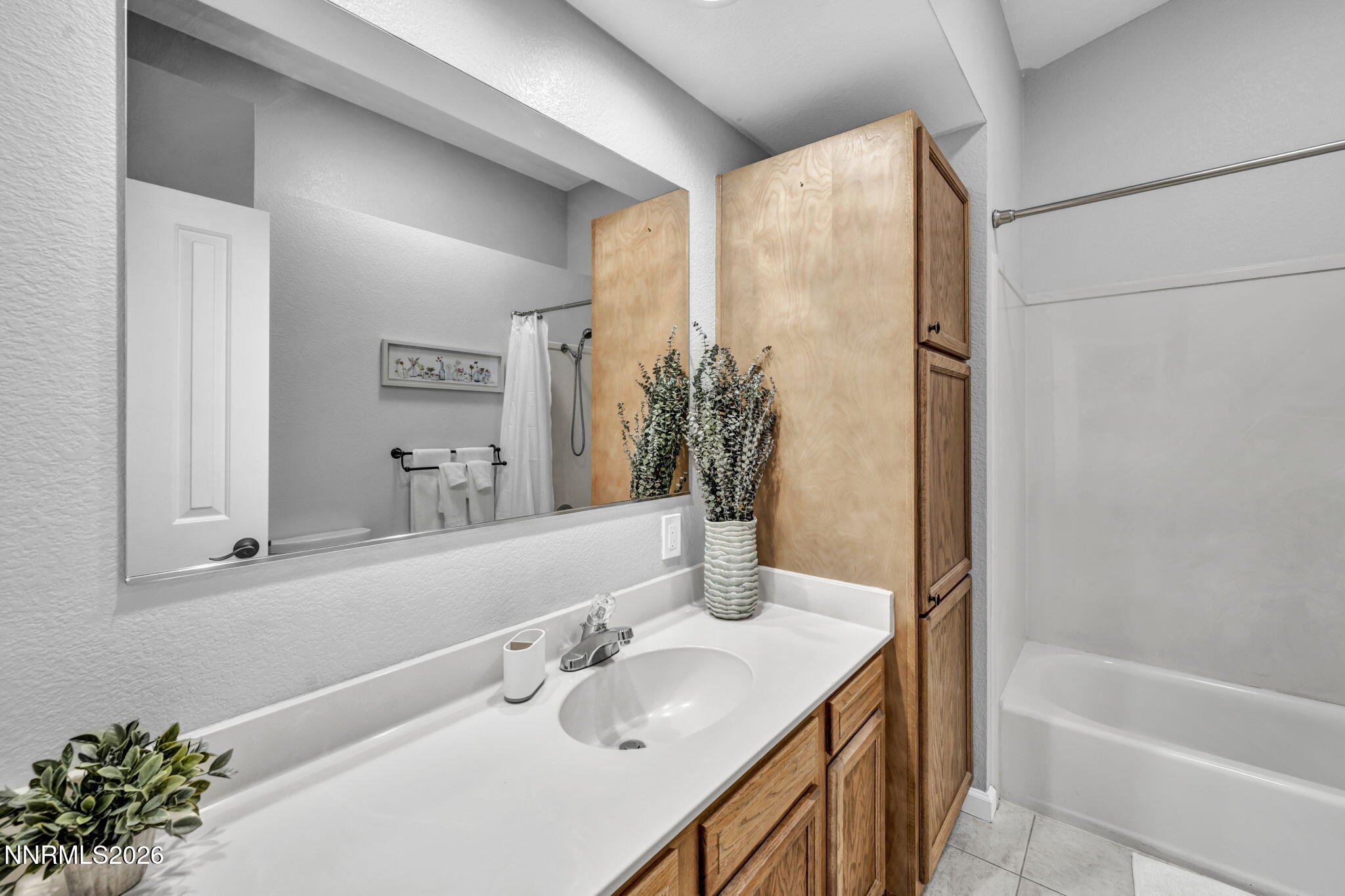 11680 Campo Rico Lane Sparks, NV 89441 - Photo 43 of 61 a bathroom with a granite countertop sink and a mirror
