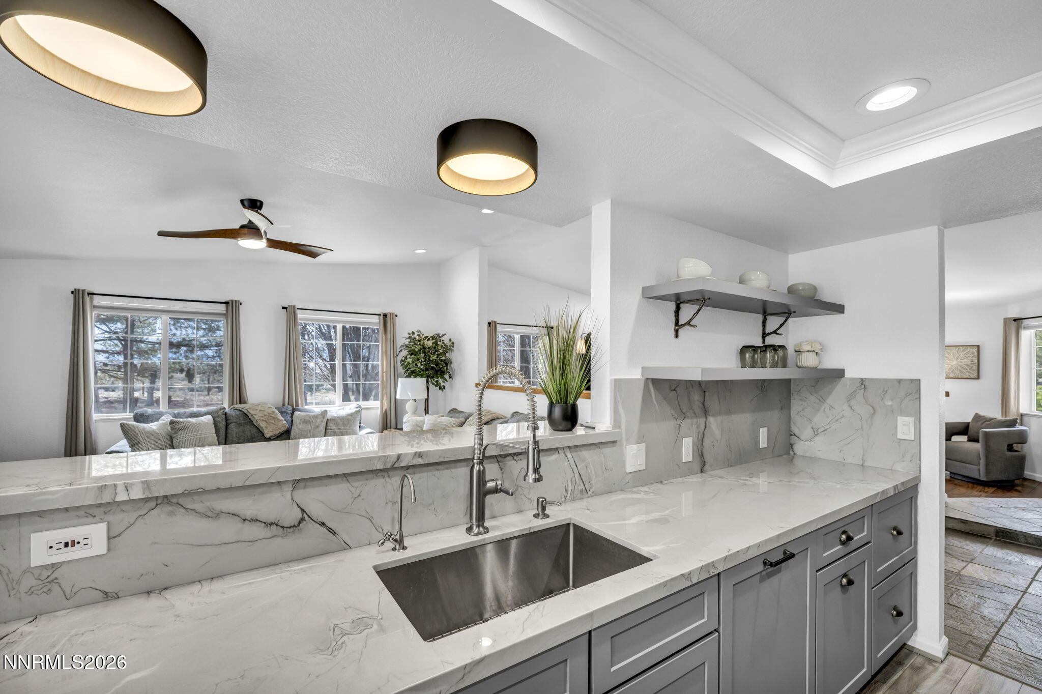 11680 Campo Rico Lane Sparks, NV 89441 - Photo 5 of 61 a kitchen with stainless steel appliances a sink a stove and a large window