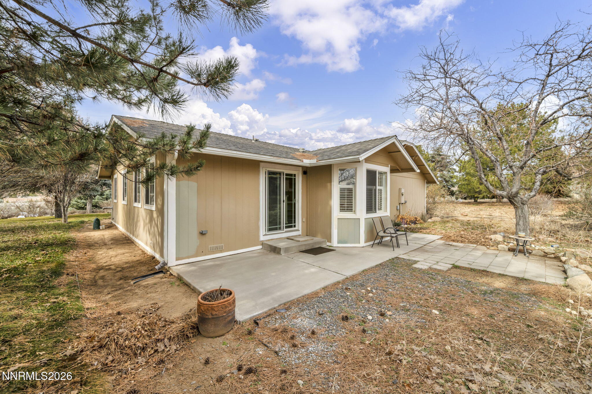11680 Campo Rico Lane Sparks, NV 89441 - Photo 51 of 61 a front view of a house with a yard and garage