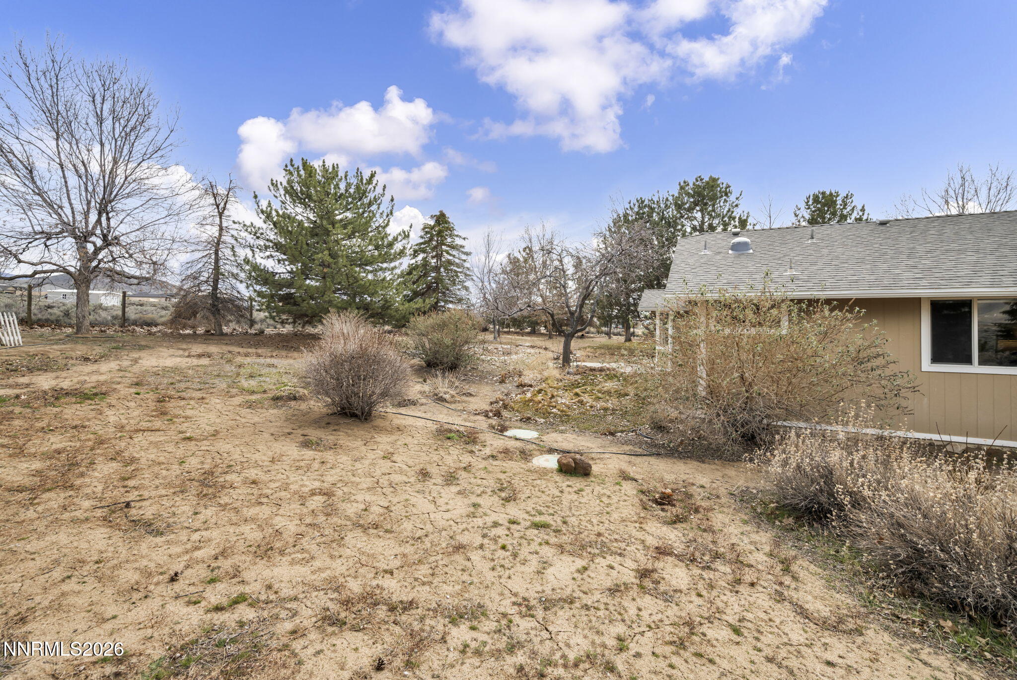 11680 Campo Rico Lane Sparks, NV 89441 - Photo 60 of 61 a backyard of a house with lots of green space