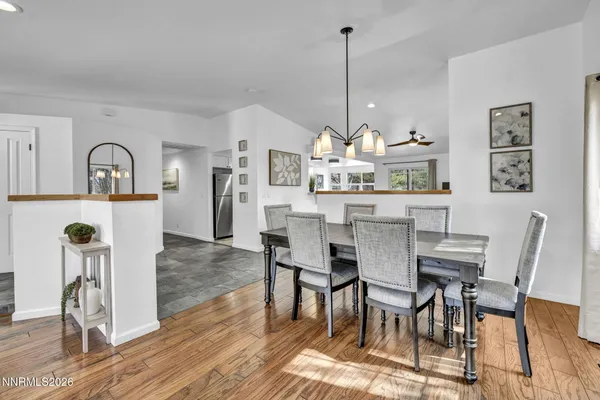 a dining room with furniture and window