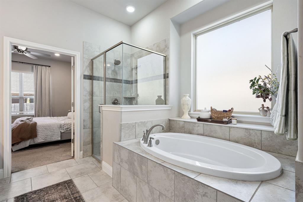 3024 Treasure View Drive Decatur, TX 76234 - Photo 16 of 22 a en suite bathroom with a tub double sink and mirror