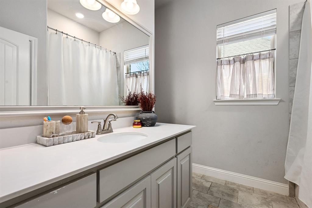 3024 Treasure View Drive Decatur, TX 76234 - Photo 18 of 22 a bathroom with a sink and a mirror