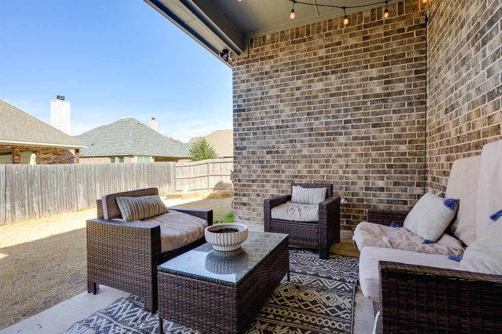 3024 Treasure View Drive Decatur, TX 76234 - Photo 22 of 22 a living room with furniture and a fireplace