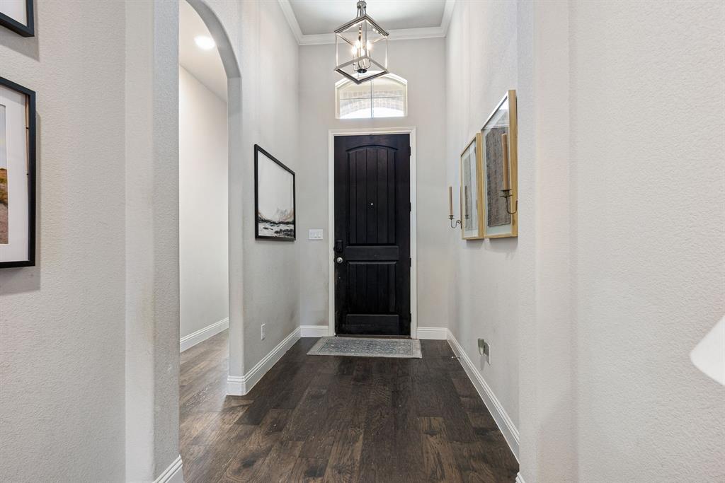 3024 Treasure View Drive Decatur, TX 76234 - Photo 5 of 22 a view of a hallway with wooden floor and staircase