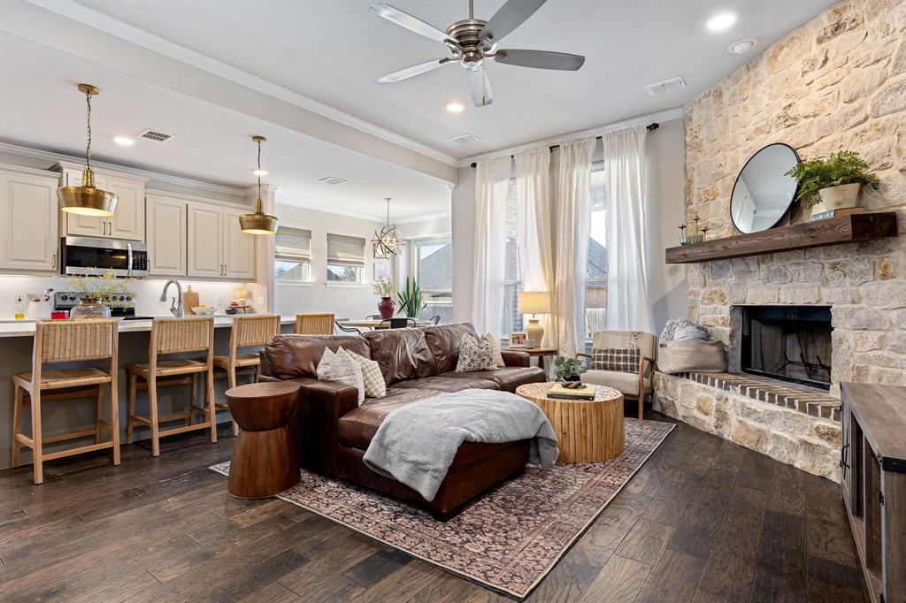 3024 Treasure View Drive Decatur, TX 76234 - Photo 6 of 22 a living room with furniture kitchen view and a fireplace