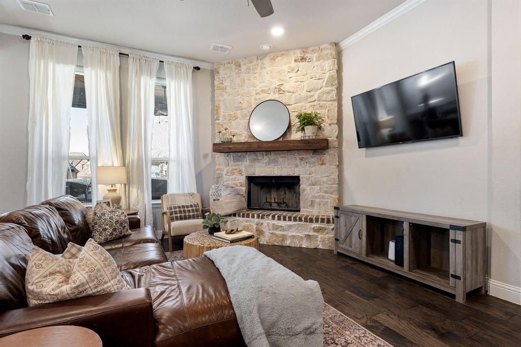 3024 Treasure View Drive Decatur, TX 76234 - Photo 8 of 22 a living room with furniture a flat screen tv and a fireplace