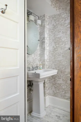 a bathroom with a shower and a sink