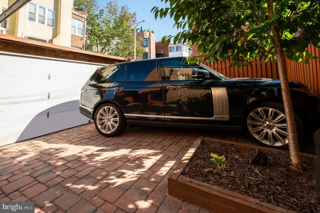 a front view of a house with parking space