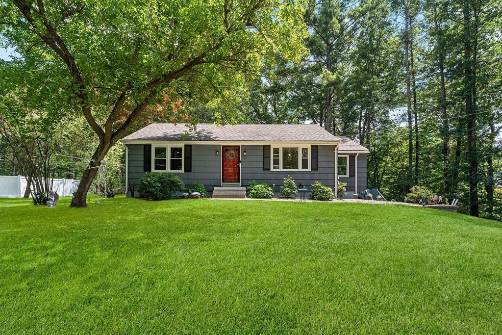 a front view of a house with a yard