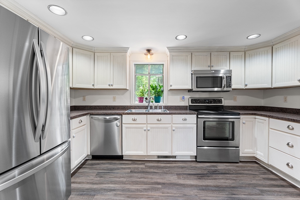 10 Mason Road Holden, MA 01522 - Photo 13 of 27 a kitchen with granite countertop a refrigerator stove and microwave