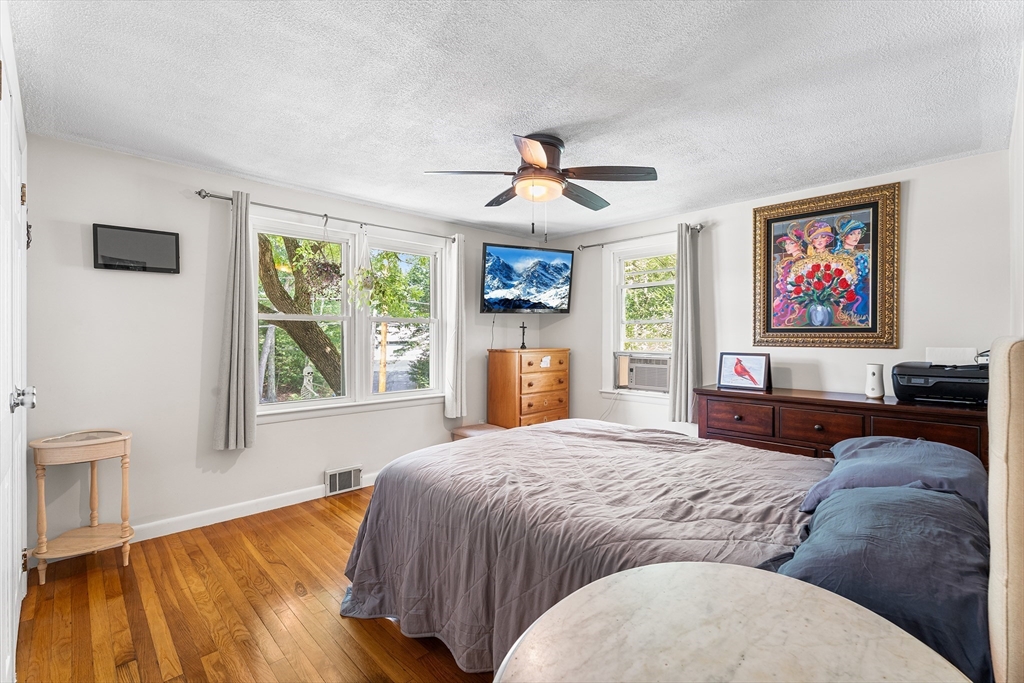 10 Mason Road Holden, MA 01522 - Photo 16 of 27 a bedroom with a bed and a flat screen tv