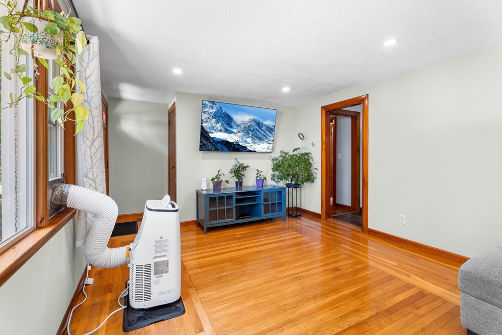 10 Mason Road Holden, MA 01522 - Photo 4 of 27 a living room with furniture a rug and a painting on the wall