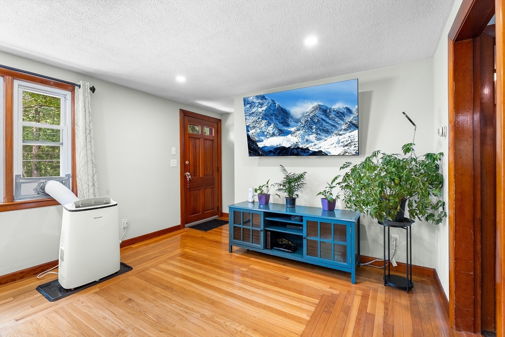 10 Mason Road Holden, MA 01522 - Photo 5 of 27 a view of a livingroom with furniture and wooden floor