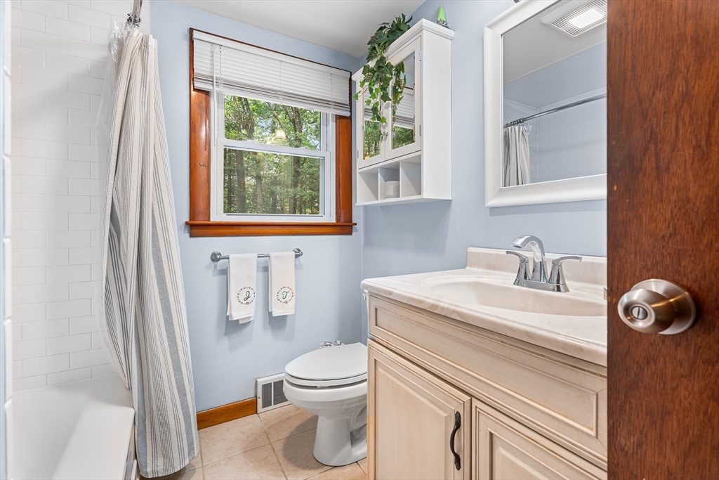 10 Mason Road Holden, MA 01522 - Photo 6 of 27 a bathroom with a sink a toilet and a window