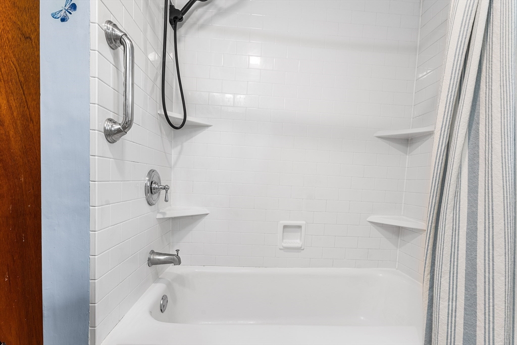 10 Mason Road Holden, MA 01522 - Photo 7 of 27 a bathroom with a bath tub