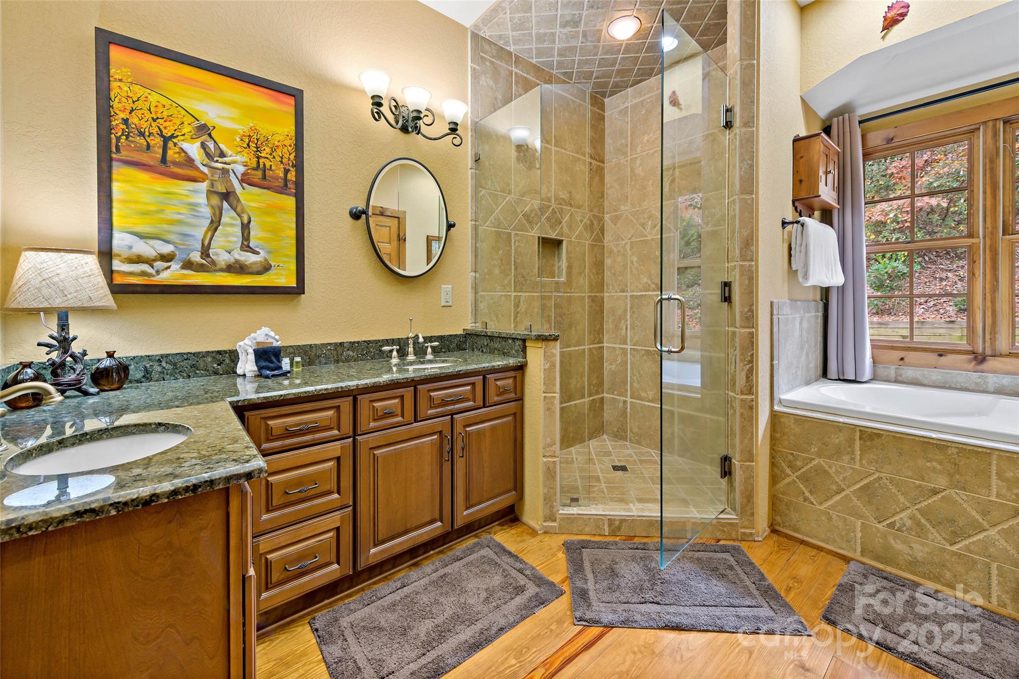 1237 South Cove Road Mill Spring, NC 28756 - Photo 15 of 44 a spacious bathroom with a granite countertop sink mirror and shower