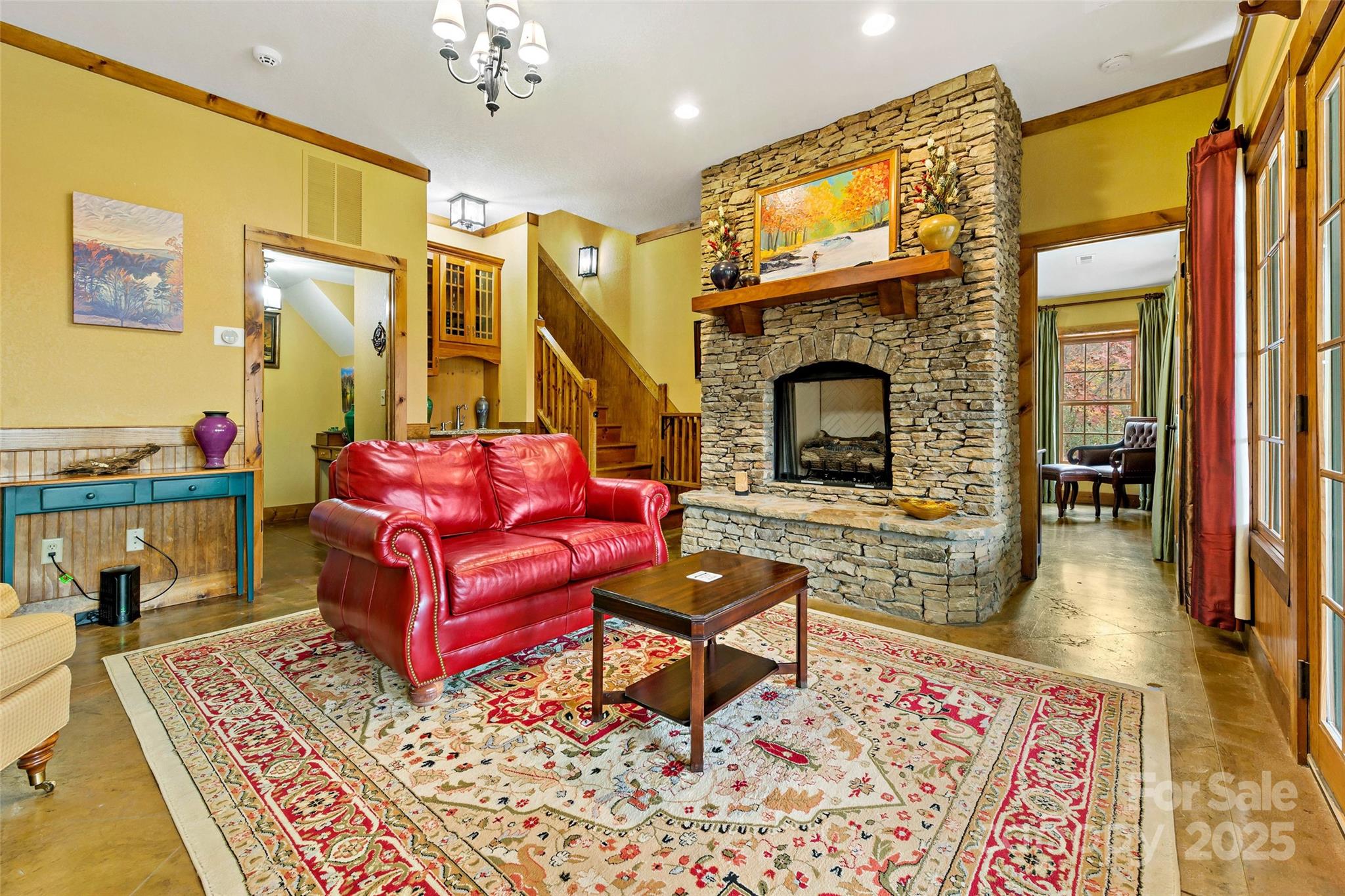 1237 South Cove Road Mill Spring, NC 28756 - Photo 23 of 44 a living room with furniture and a fireplace
