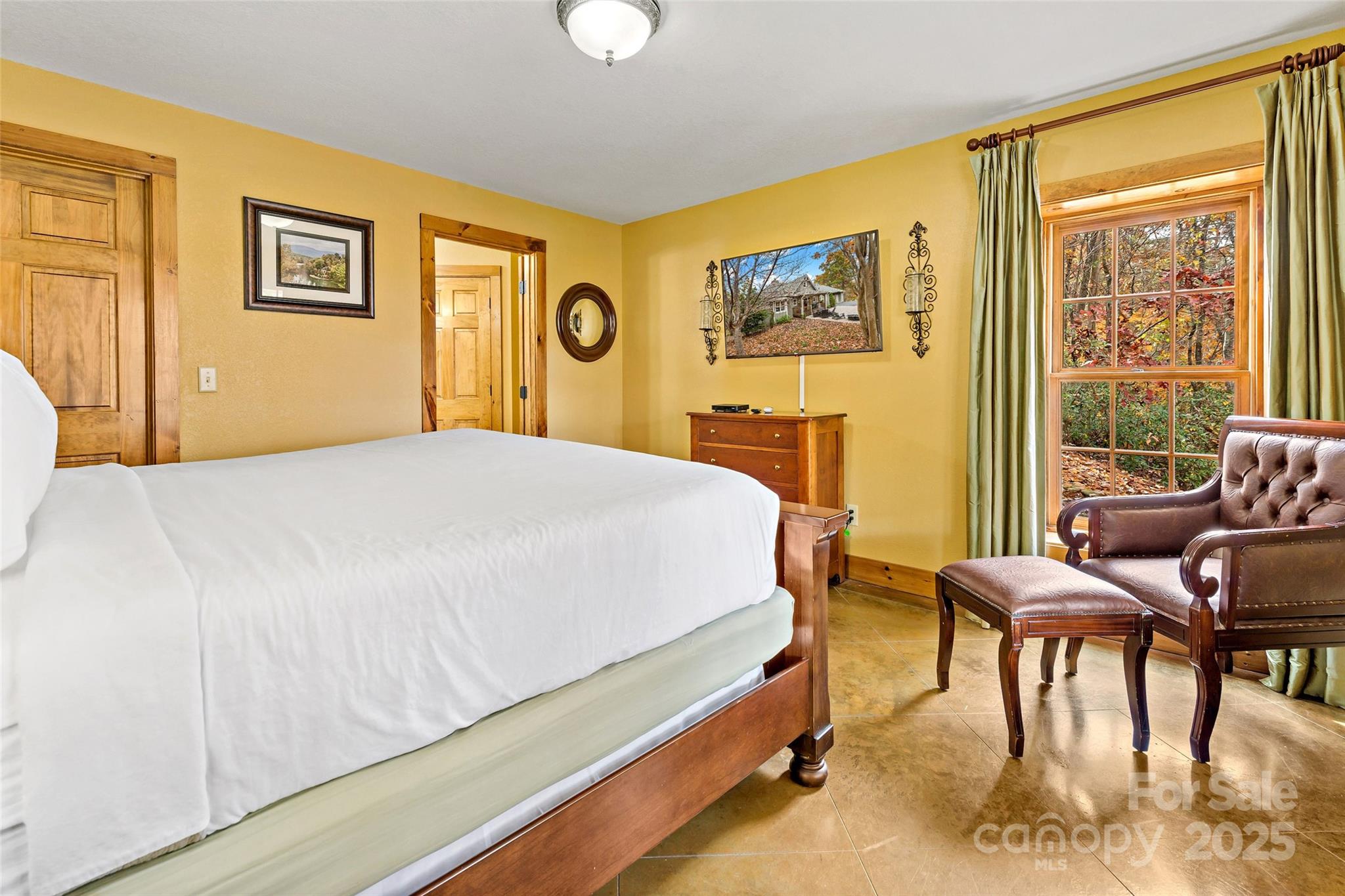 1237 South Cove Road Mill Spring, NC 28756 - Photo 29 of 44 a bedroom with a bed and a table