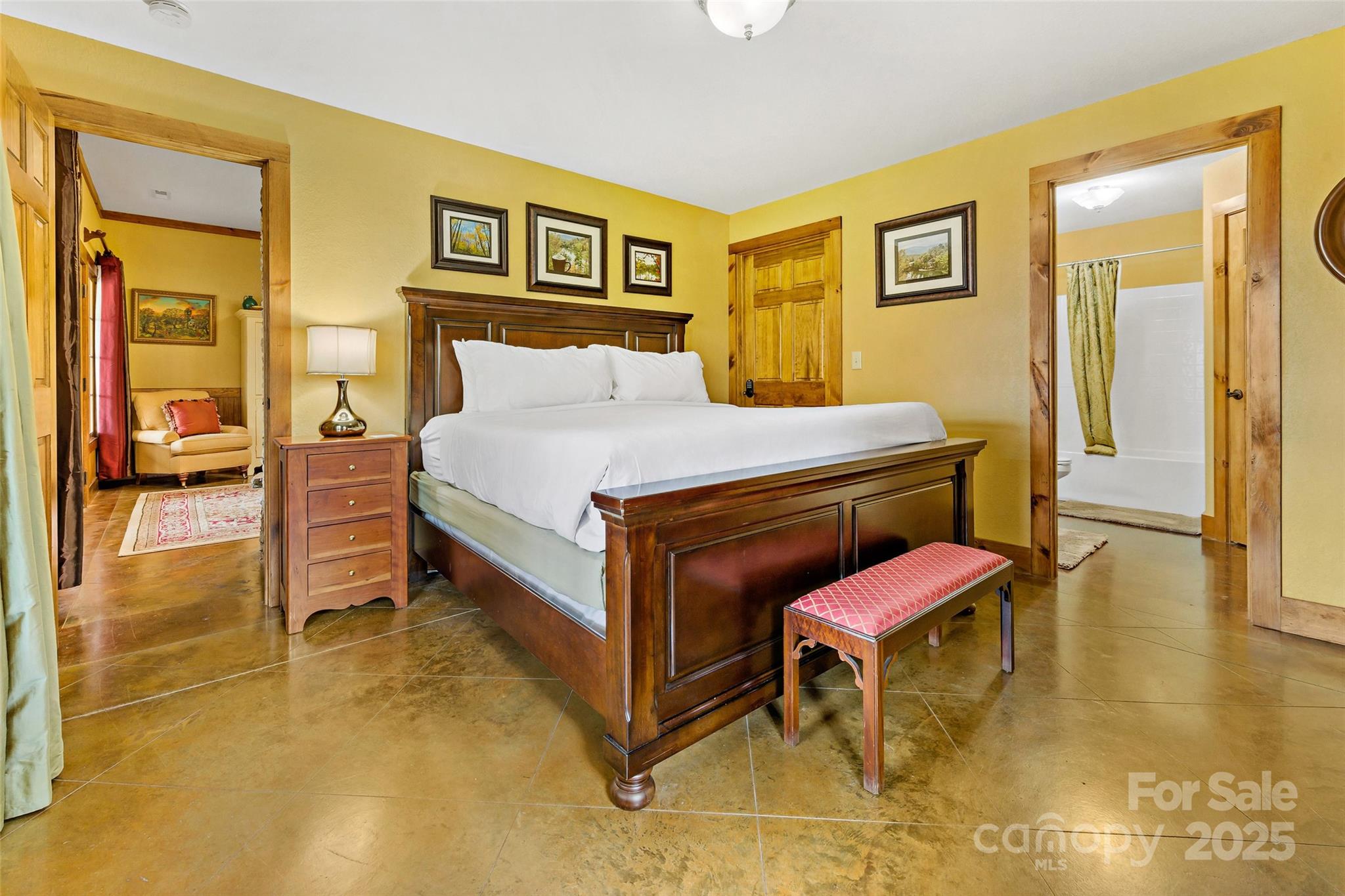 1237 South Cove Road Mill Spring, NC 28756 - Photo 30 of 44 a bedroom with a bed and wooden floor