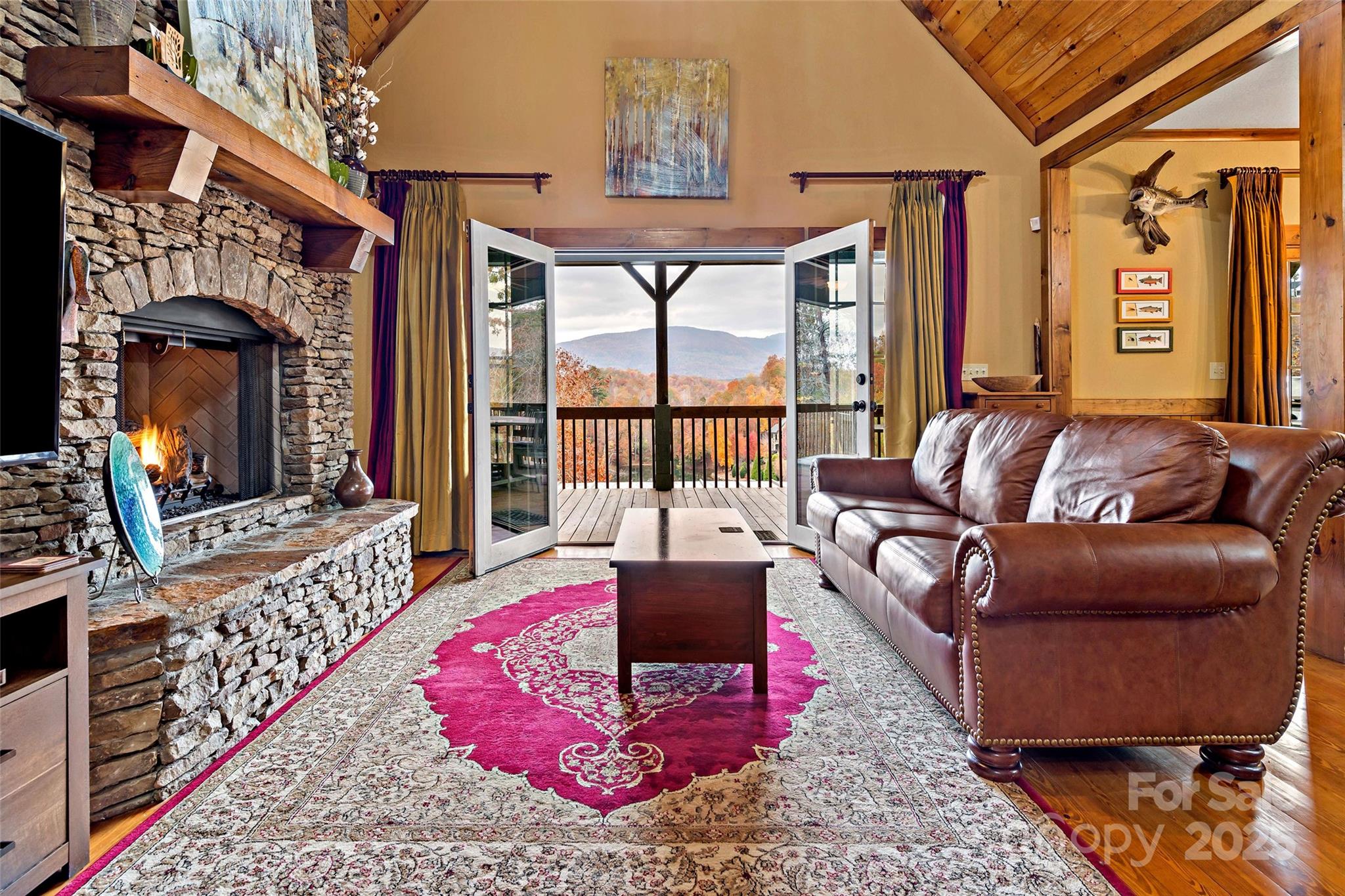 1237 South Cove Road Mill Spring, NC 28756 - Photo 4 of 44 a living room with furniture or couch and a large window