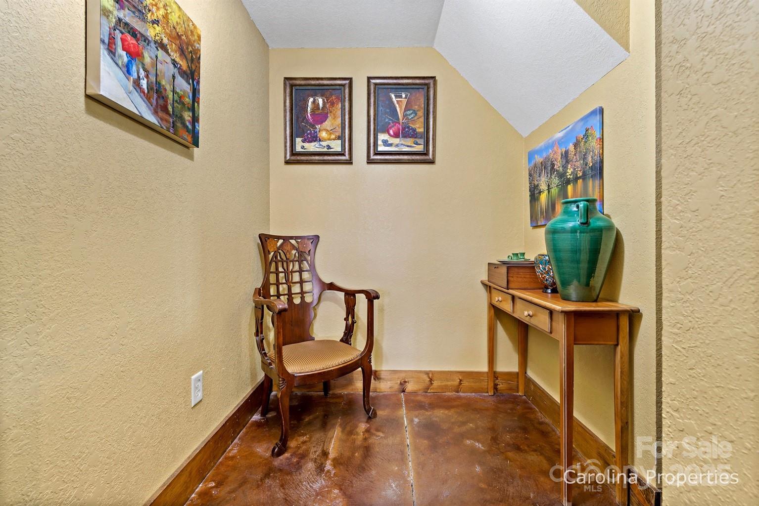 1237 South Cove Road Mill Spring, NC 28756 - Photo 43 of 44 a view of a workspace with furniture and a potted plant