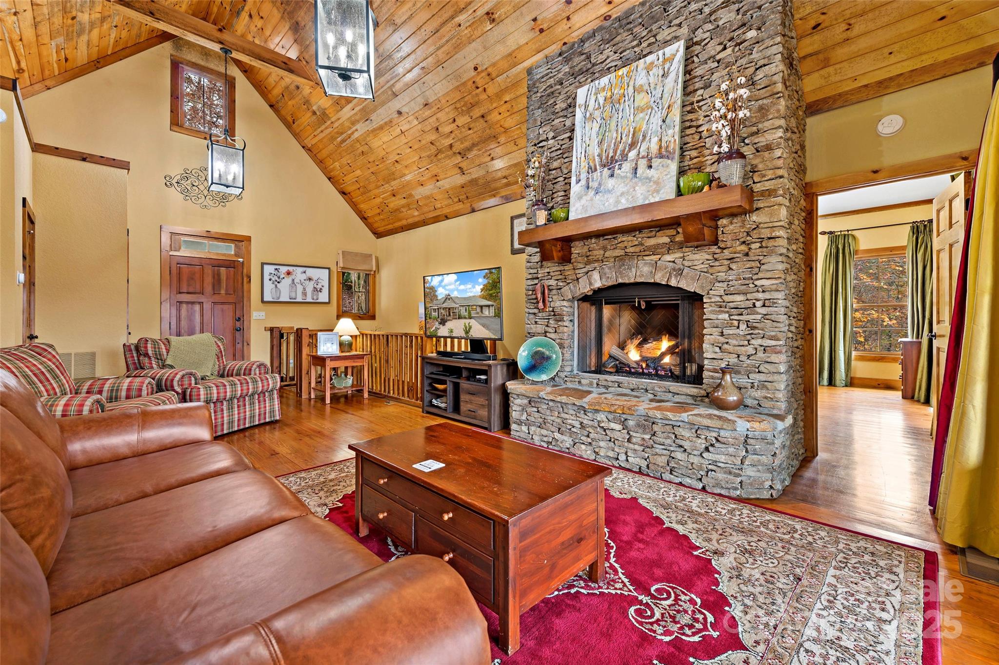1237 South Cove Road Mill Spring, NC 28756 - Photo 6 of 44 a living room with furniture and a fireplace