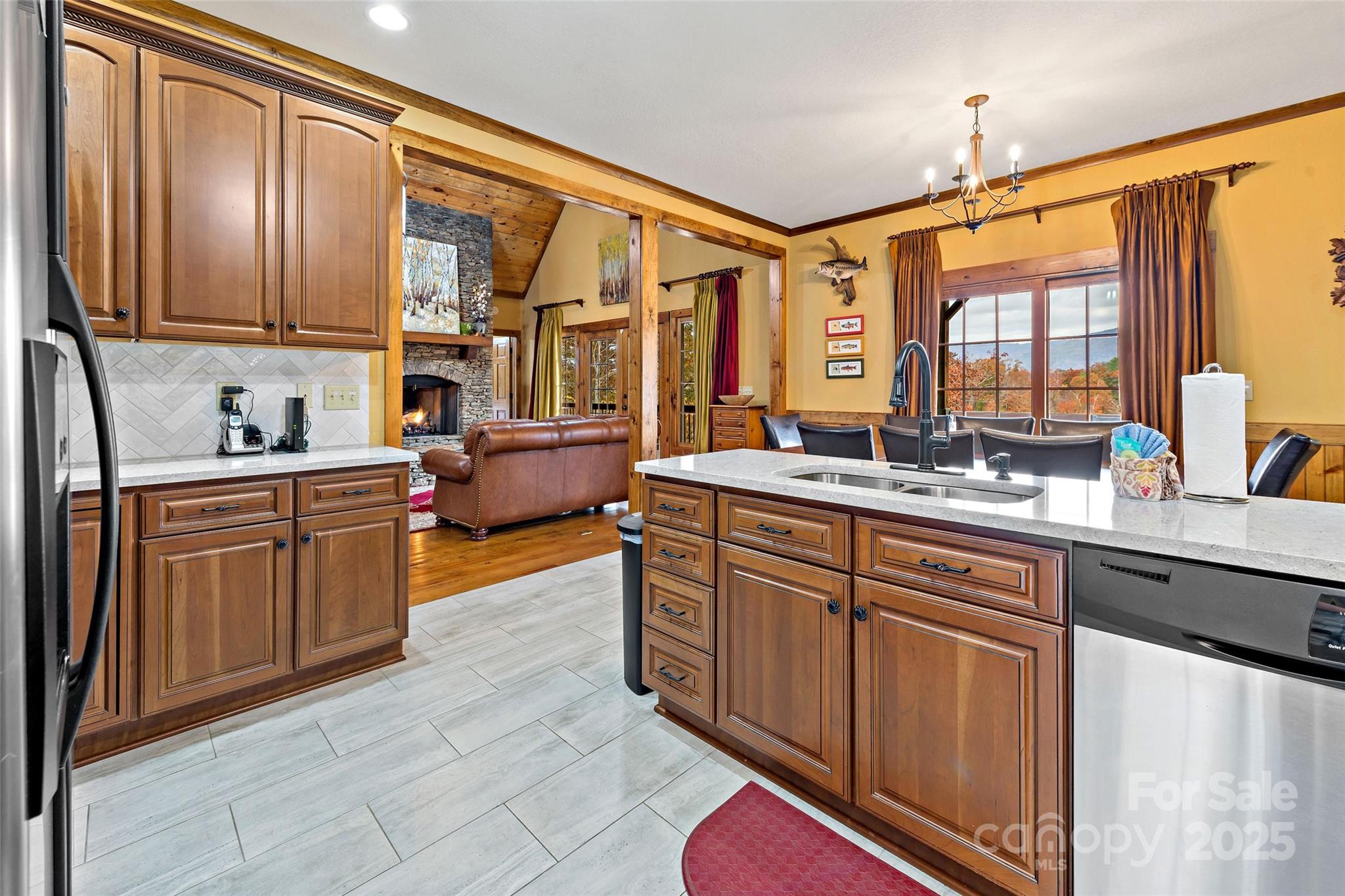 1237 South Cove Road Mill Spring, NC 28756 - Photo 10 of 44 a spacious kitchen with stainless steel appliances granite countertop a sink and cabinets