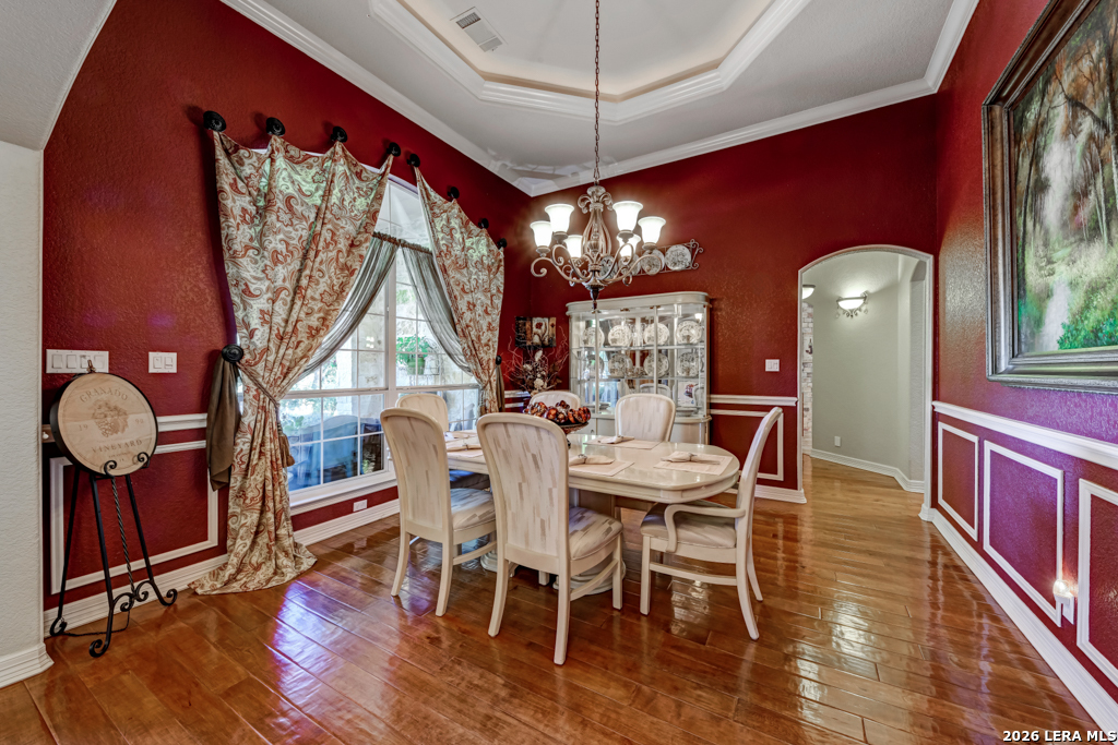 1700 Frontier Spring Branch, TX 78070 - Photo 17 of 74 a view of a dining room with furniture a chandelier and wooden floor