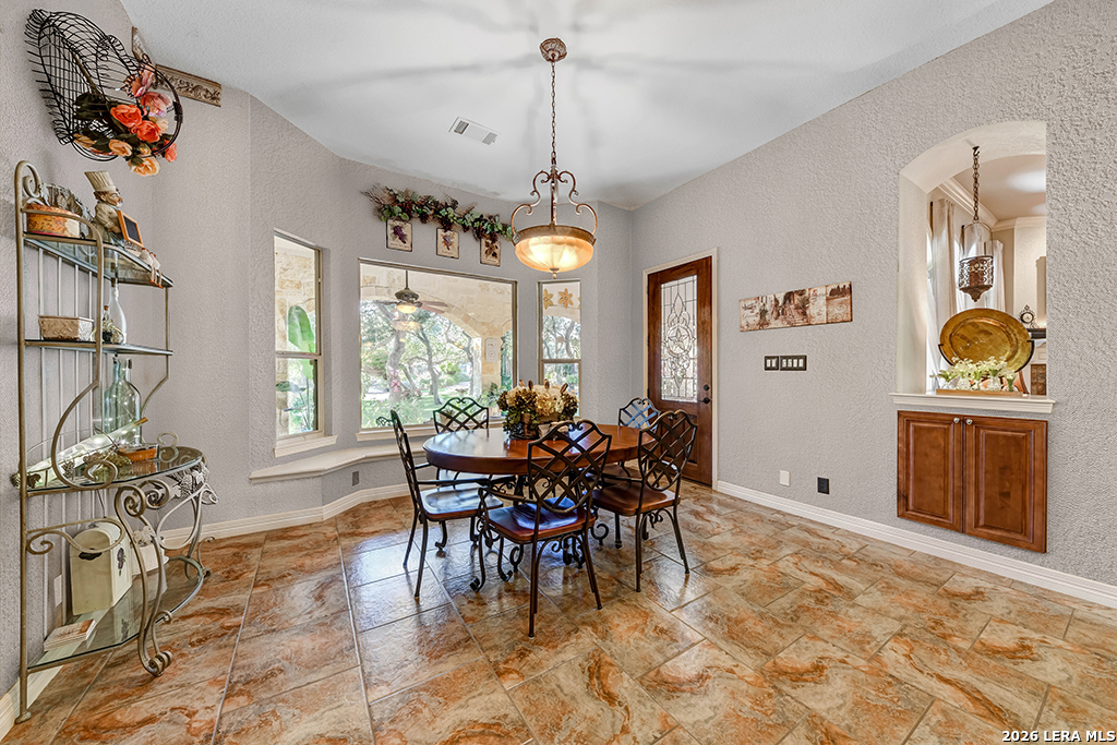 1700 Frontier Spring Branch, TX 78070 - Photo 30 of 74 a view of a dining room and livingroom with furniture wooden floor a chandelier