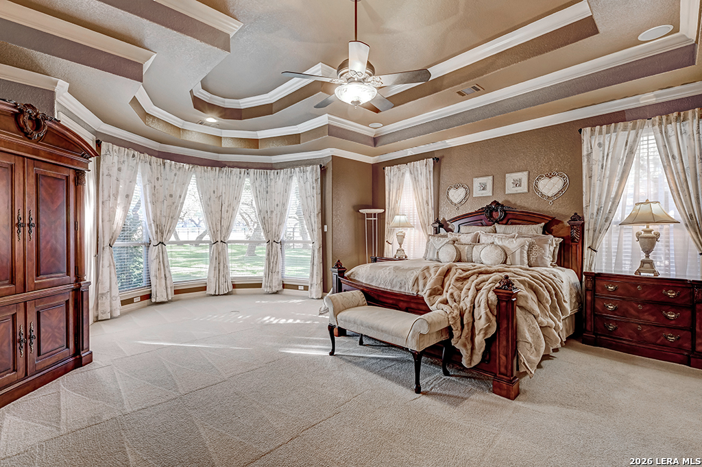 1700 Frontier Spring Branch, TX 78070 - Photo 38 of 74 a spacious bedroom with a bed a chandelier and a large window