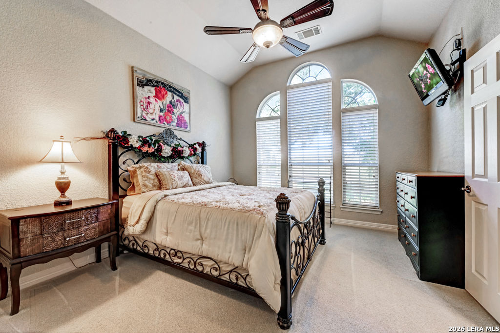 1700 Frontier Spring Branch, TX 78070 - Photo 43 of 74 a spacious bedroom with a bed and a chandelier