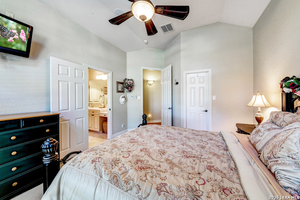 1700 Frontier Spring Branch, TX 78070 - Photo 44 of 74 a bedroom with a bed and a flat tv screen on dresser