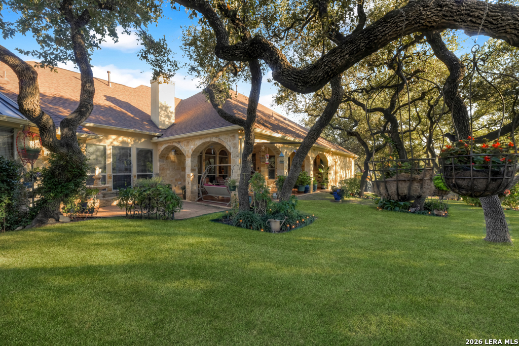 1700 Frontier Spring Branch, TX 78070 - Photo 54 of 74 a front view of a house with a garden
