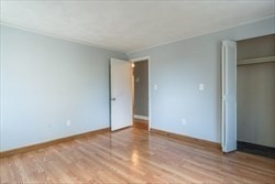 22 Irving Street, Unit 8 Everett, MA 02149 - Photo 11 of 18 a view of an empty room and wooden floor