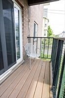 22 Irving Street, Unit 8 Everett, MA 02149 - Photo 14 of 18 a view of balcony with wooden floor