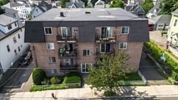 22 Irving Street, Unit 8 Everett, MA 02149 - Photo 17 of 18 a front view of a house with garden