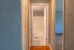 22 Irving Street, Unit 8 Everett, MA 02149 - Photo 8 of 18 a view of a bathroom with a glass door