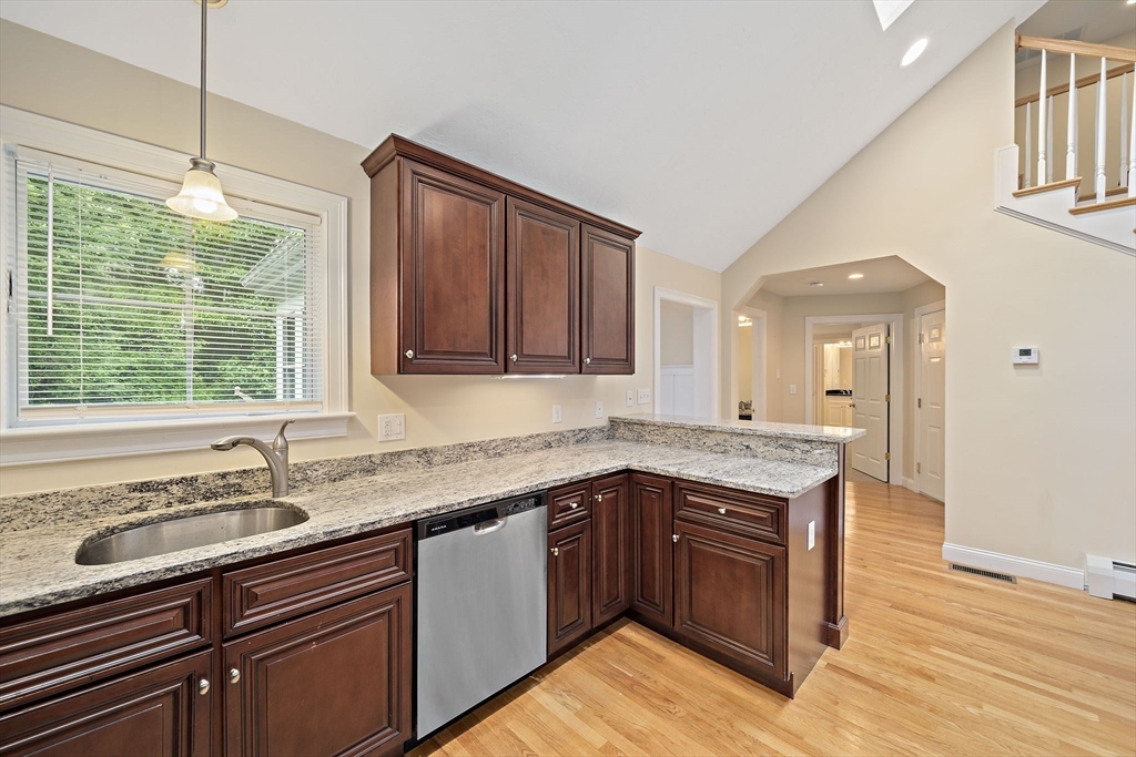 14 Sugar Maple Circle, Unit 14 Hanover, MA 02339 - Photo 6 of 38 a kitchen with a sink stove and cabinets
