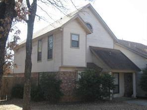 a house with trees in front of it