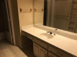 3104 Timber Ridge Grapevine, TX 76051 - Photo 5 of 12 a bathroom with a sink and a mirror